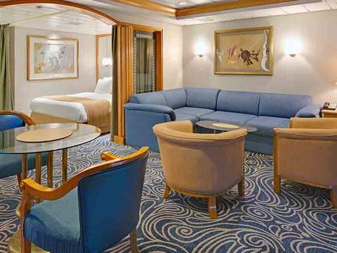 Rhapsody of the Seas Owner's Suite - 1 Bedroom (OS) living area, photo 1 of 3