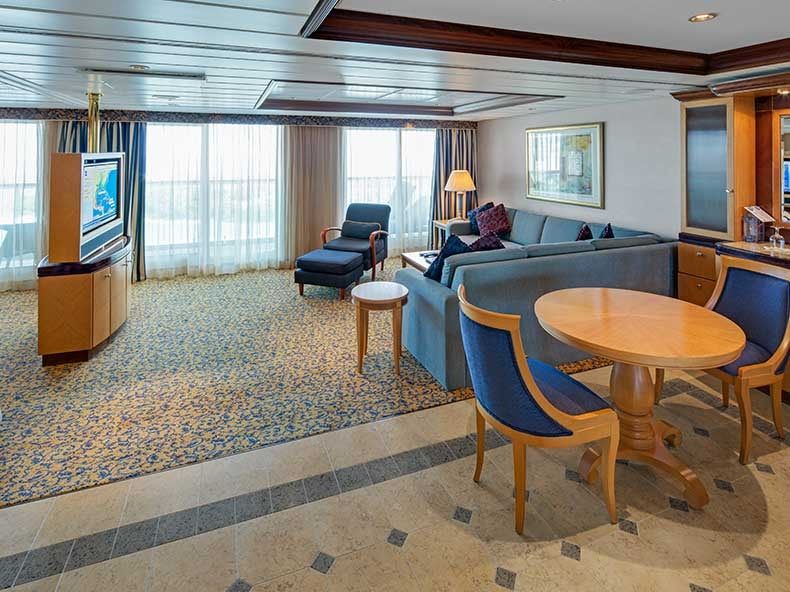 Serenade of the Seas Owner's Suite - 1 Bedroom (OS) living area, photo 1 of 3