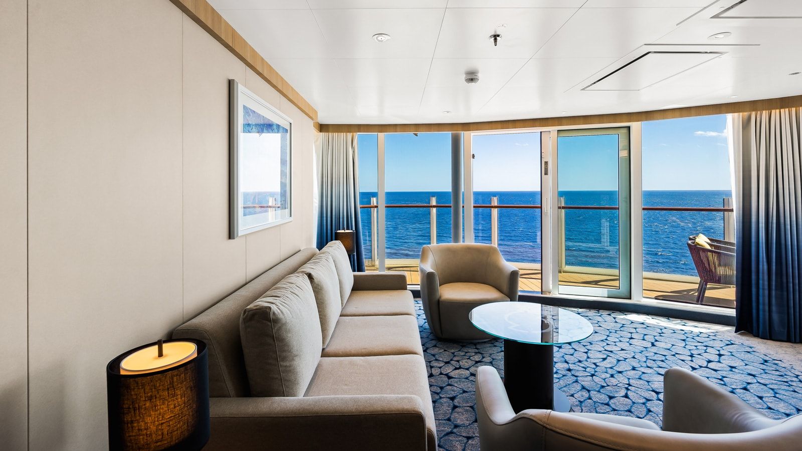 Wonder of the Seas Spacious AquaTheater Suite - 1 Bedroom (A3) living area, photo 1 of 3