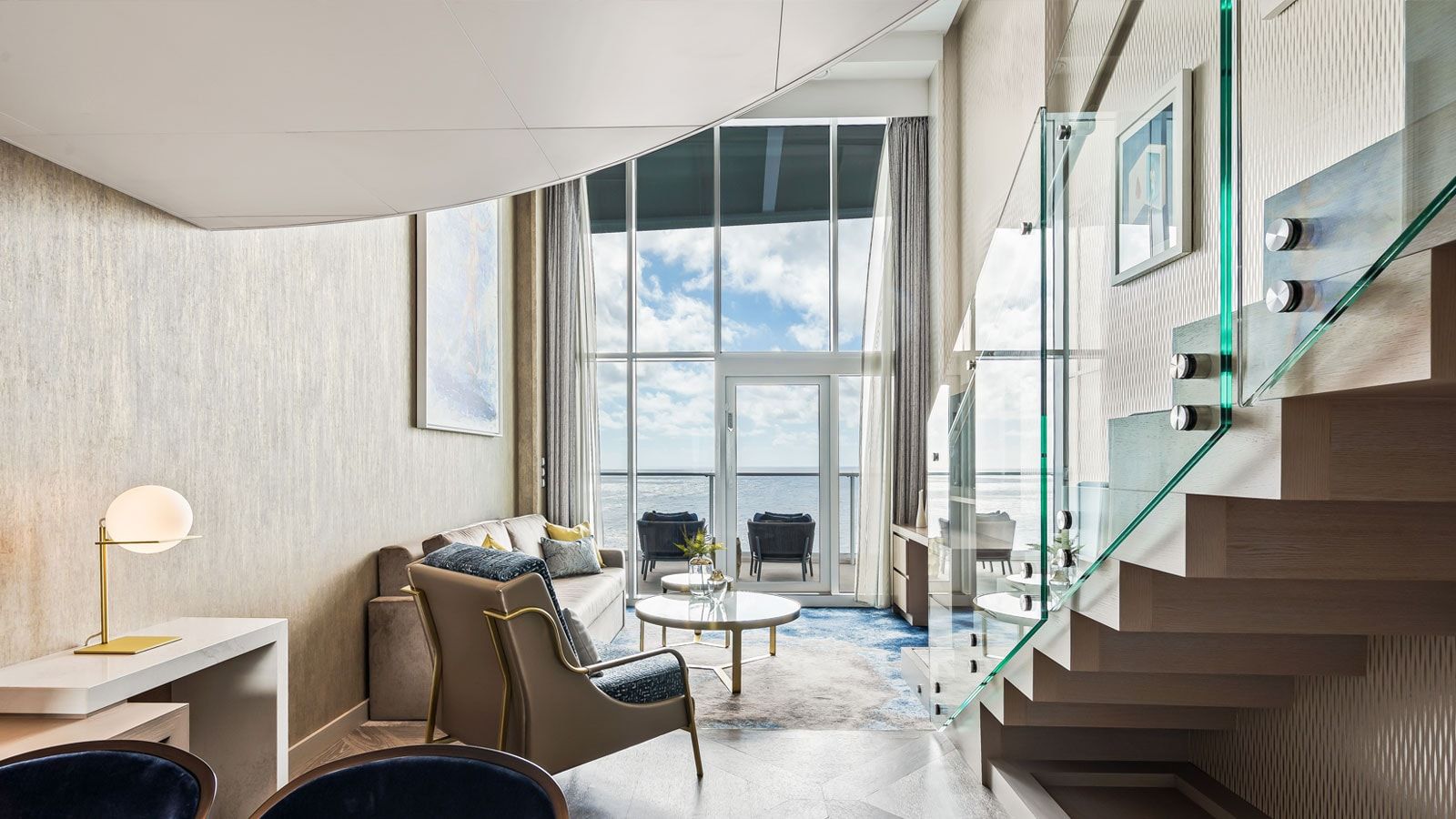 Utopia of the Seas Crown Loft Suite (L1) living area, photo 1 of 5