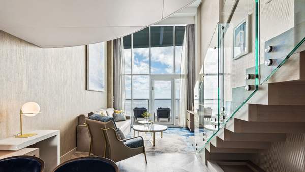 Utopia of the Seas Crown Loft Suite (L1) living area, photo 1 of 5 Utopia of the Seas Crown Loft Suite (L1) living area, photo 1 of 5