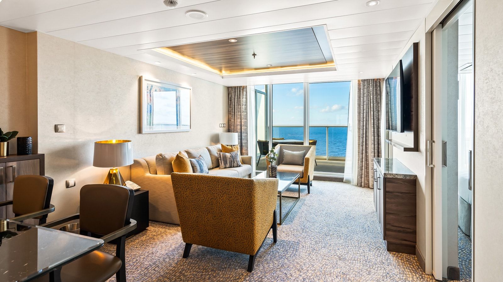 Utopia of the Seas Owner's Suite - 1 Bedroom (OS) living area, photo 1 of 4