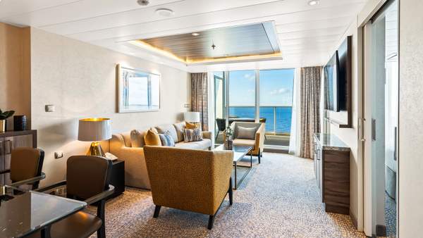 Wonder of the Seas Owner's Suite - 1 Bedroom (OS) living area, photo 1 of 4