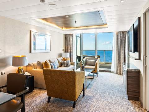 Utopia of the Seas Owner's Suite - 1 Bedroom (OS) living area, photo 1 of 4