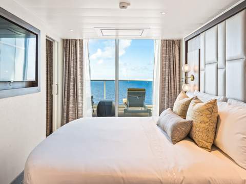 Utopia of the Seas Owner's Suite - 1 Bedroom (OS) bedroom