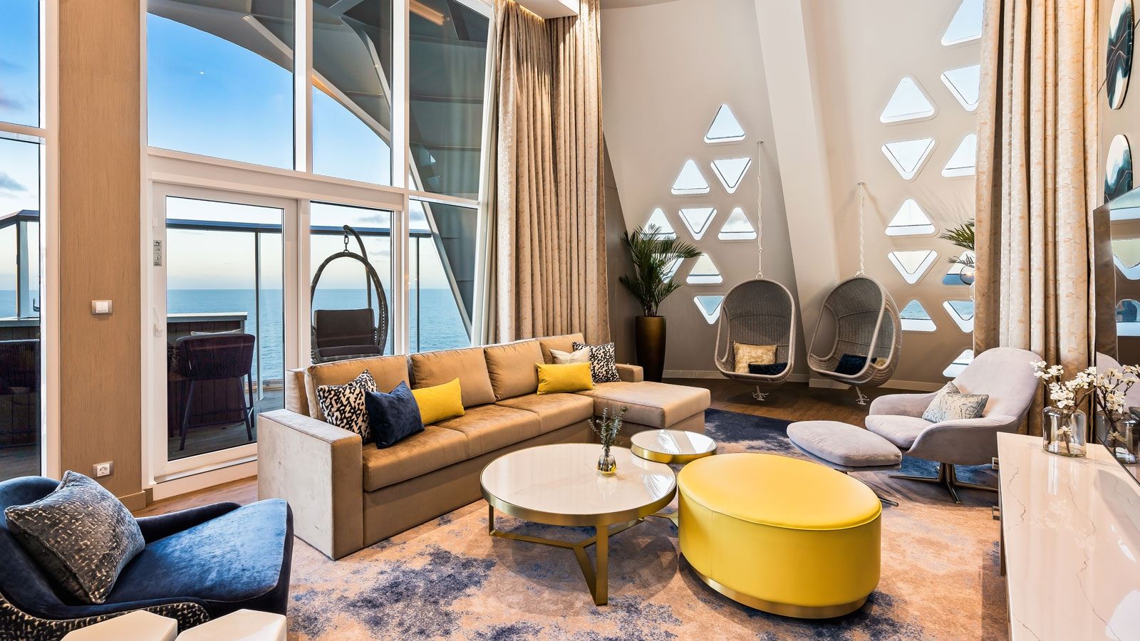 Utopia of the Seas Royal Loft Suite (RL) living area, photo 1 of 8