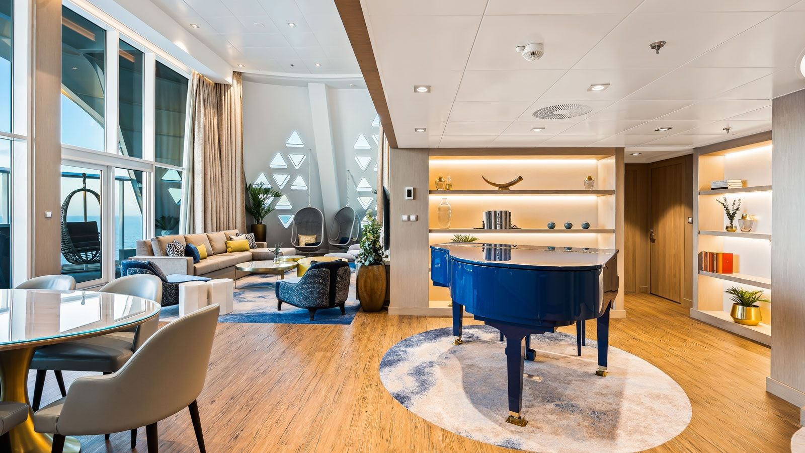 Utopia of the Seas Royal Loft Suite (RL) living area, photo 2 of 8