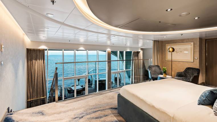 Utopia of the Seas Royal Loft Suite (RL) bedroom, photo 1 of 4