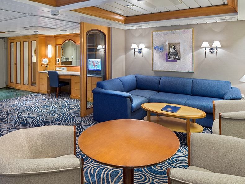 Vision of the Seas Owner's Suite - 1 Bedroom (OS) living area, photo 1 of 3