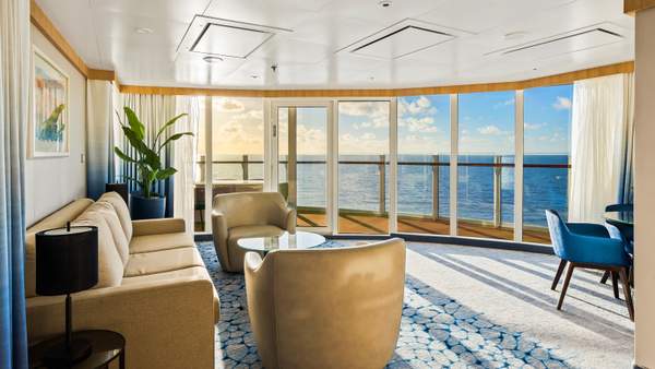 Wonder of the Seas Spacious AquaTheater Suite Large Balcony - 2 Bedroom (A1) living area, photo 1 of 3