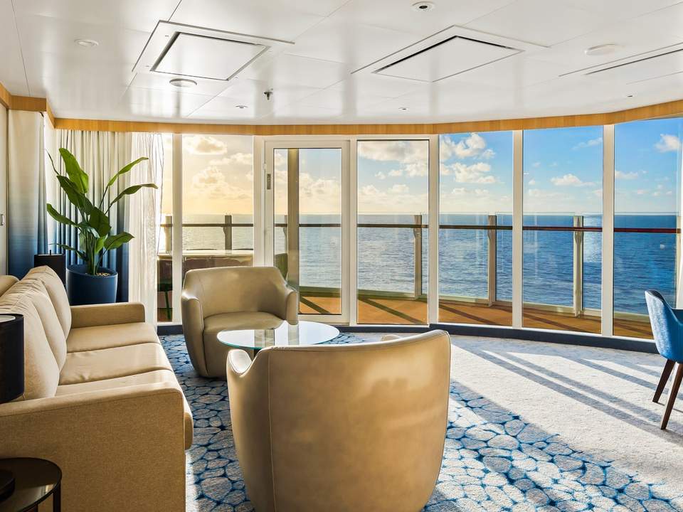 Wonder of the Seas Spacious AquaTheater Suite Large Balcony - 2 Bedroom (A1) living area, photo 1 of 3