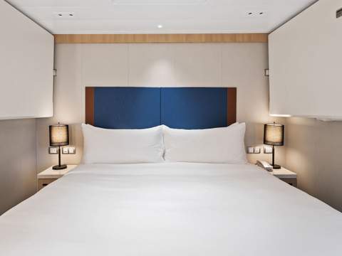 Wonder of the Seas Spacious AquaTheater Suite Large Balcony - 2 Bedroom (A1) bedroom, photo 2 of 2